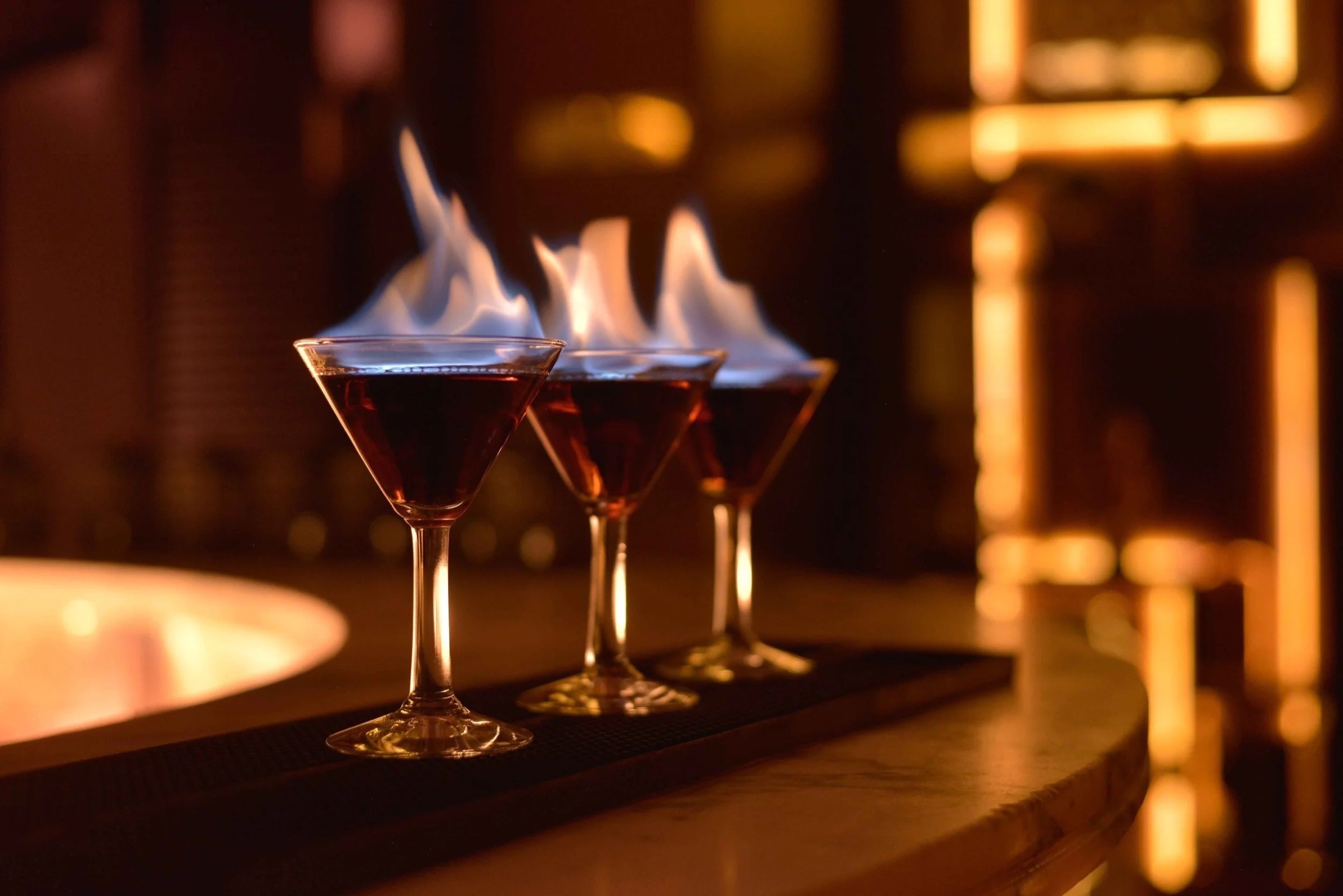 Three Flaming Ferrari cocktails alight